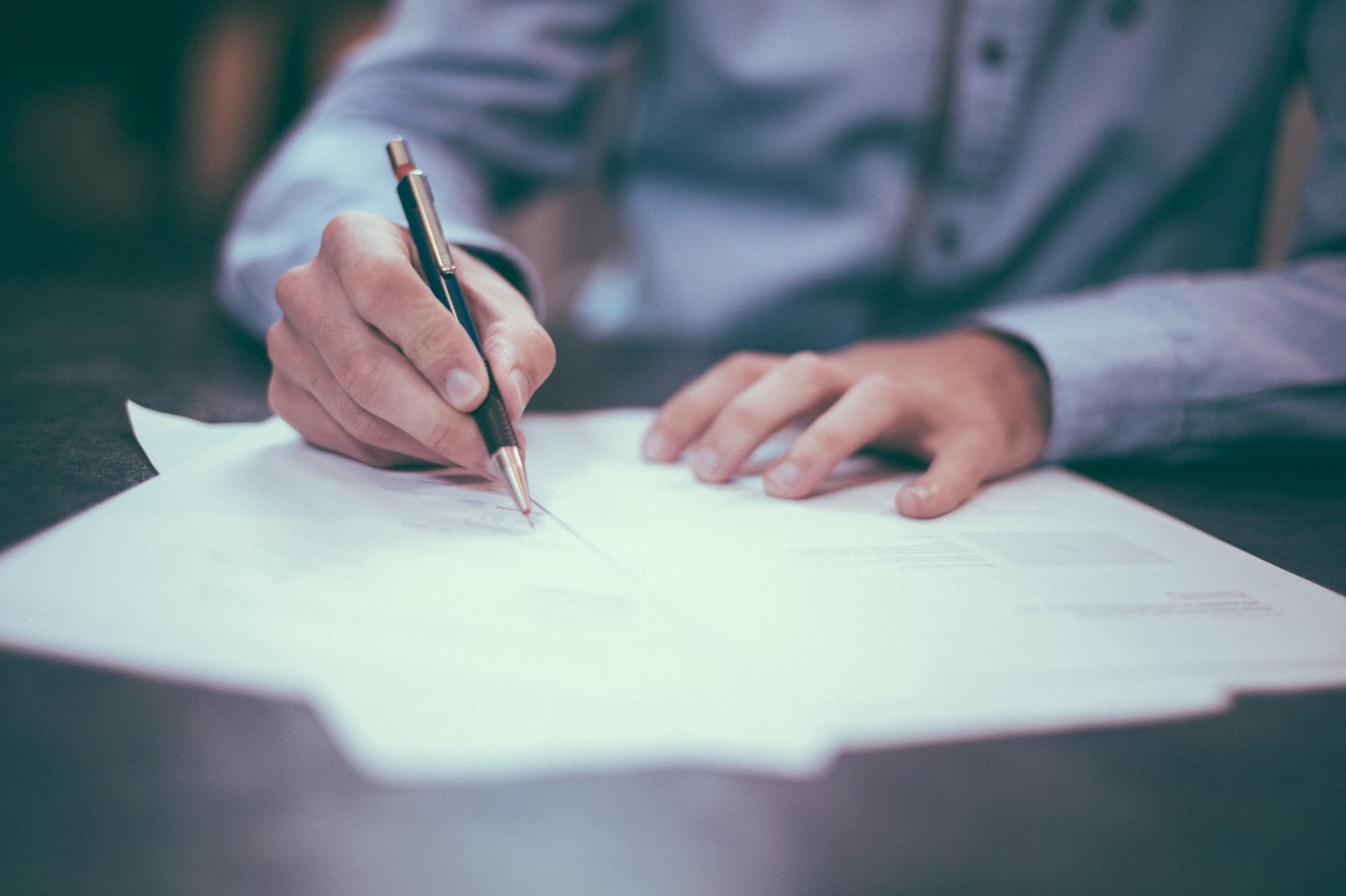 Pen signing a tax or regulatory document